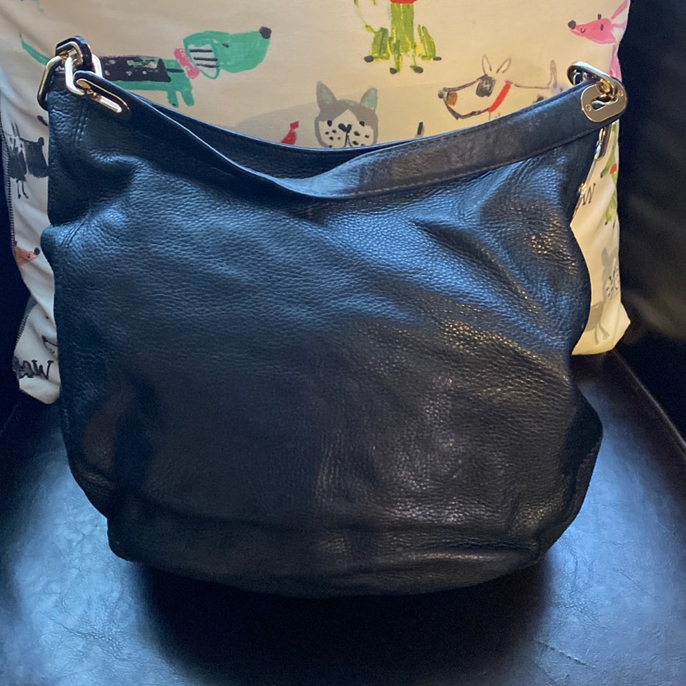 Gorgeous Michael Kors leather purse with gold hardware.